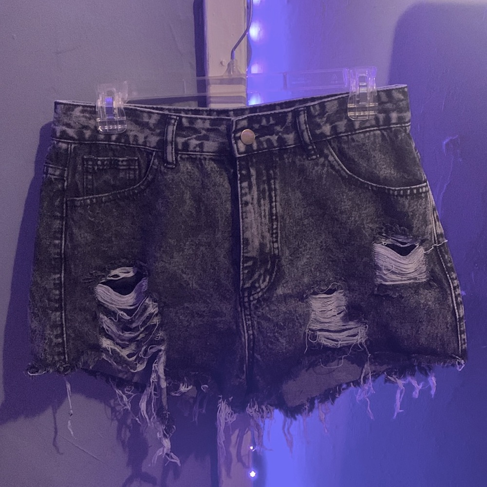 Gray ripped shorts.